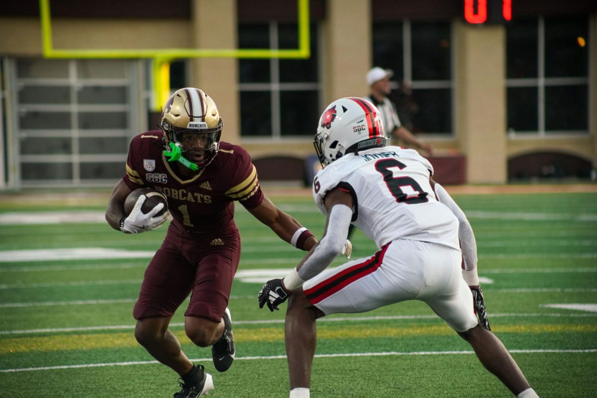 Texas State sophomore wide receiver Chris Dawn Jr. (1) sizes up the Arkansas State defense after a successful catch, Saturday, Oct. 12, 2024, at UFCU Stadium.