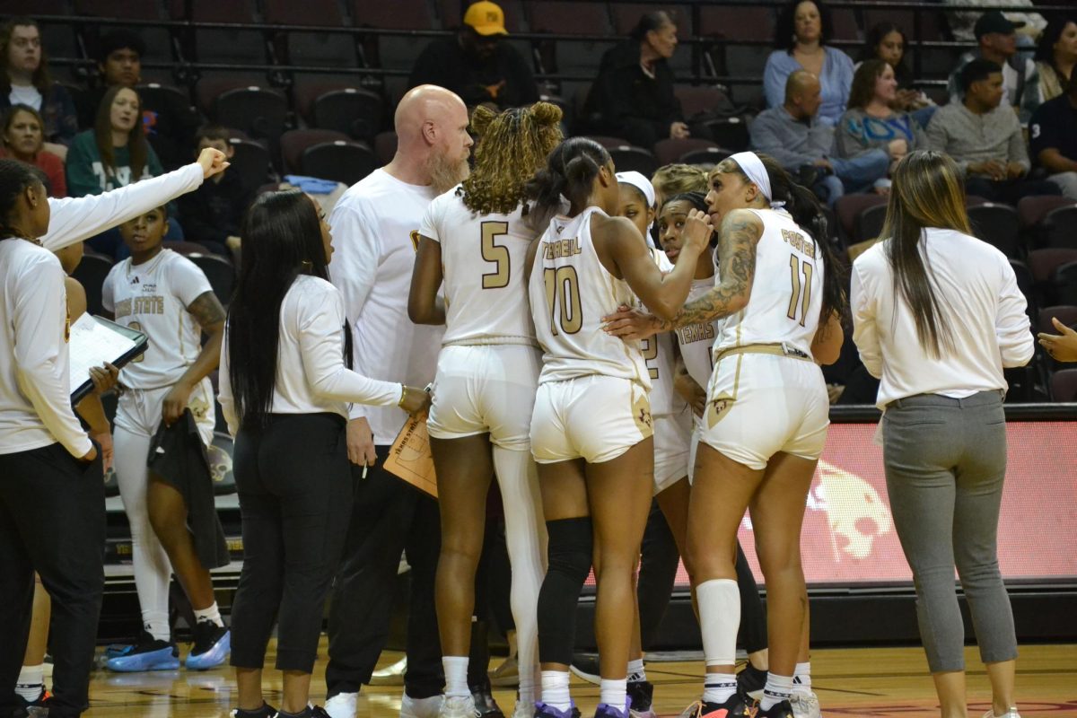 Jaylin Foster, Bobcat forward, speaks to teammate Destiny Terrell in a team huddle January 23, 2025, at Strahan Arena.