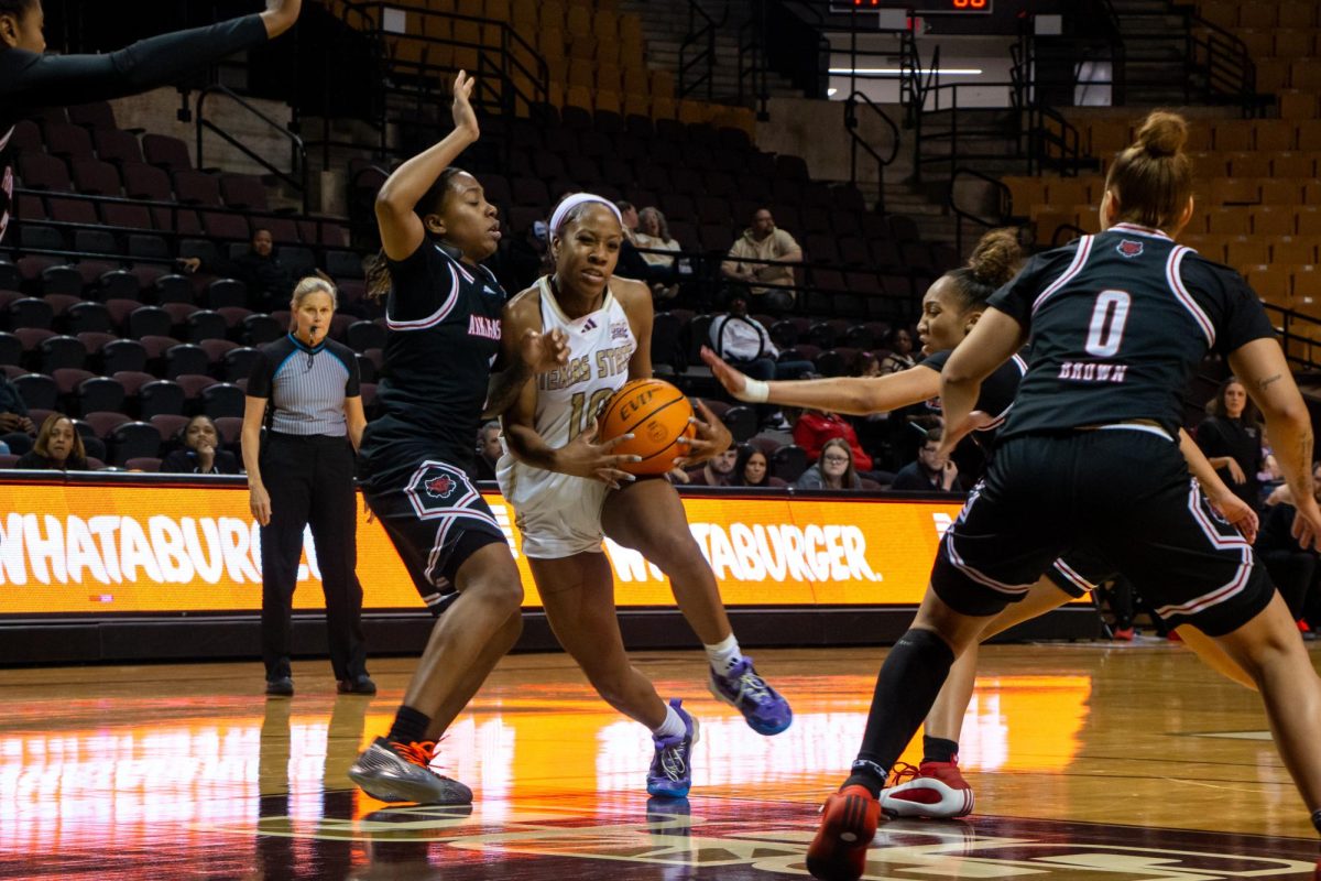 Graduate guard Destiny Terrell (#10) bumps into an Arkansas State University player during the game, Wednesday, Jan. 8, 2025, at Strahan Arena.