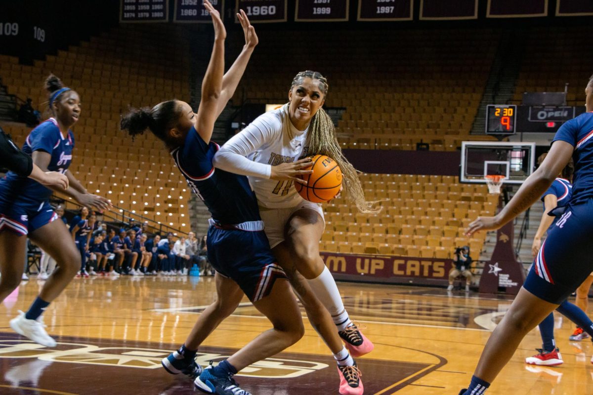 Senior forward Jaylin Foster (#11) bumps into a University of South Alabama player while rushing for a field goal during the game, Saturday, Jan. 11, 2025, at Strahan Arena.