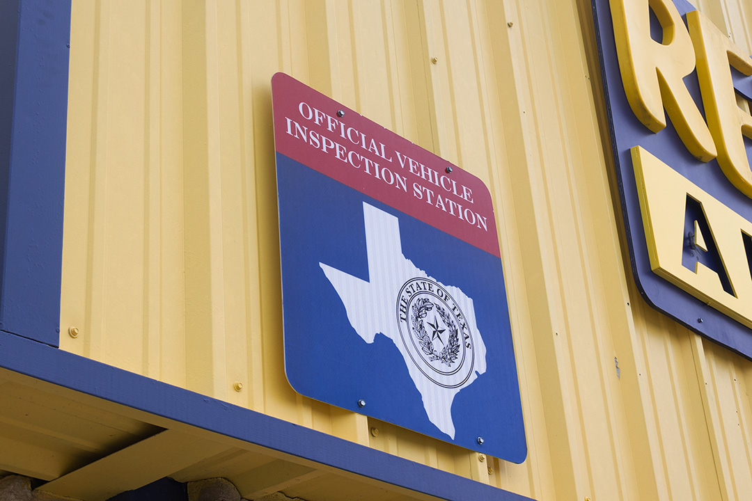 State inspection sign sits outside of Reliable Automotive, Wednesday, Jan. 8, 2024 on 1201 N SH-123.