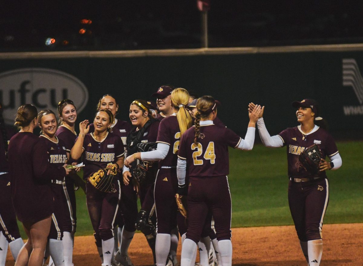 The Texas State softball team celebrate after they win against New Mexico on Saturday, Feb. 15, 2025, at Bobcat Ballpark.