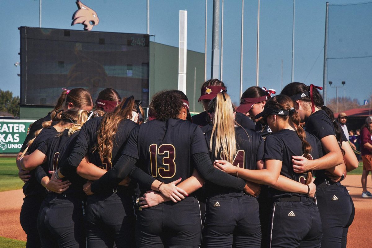 The Texas State Softball team huddles awaiting their game against Lipscomb University on Saturday, February 8, 2025, at Bobcat Ballpark.