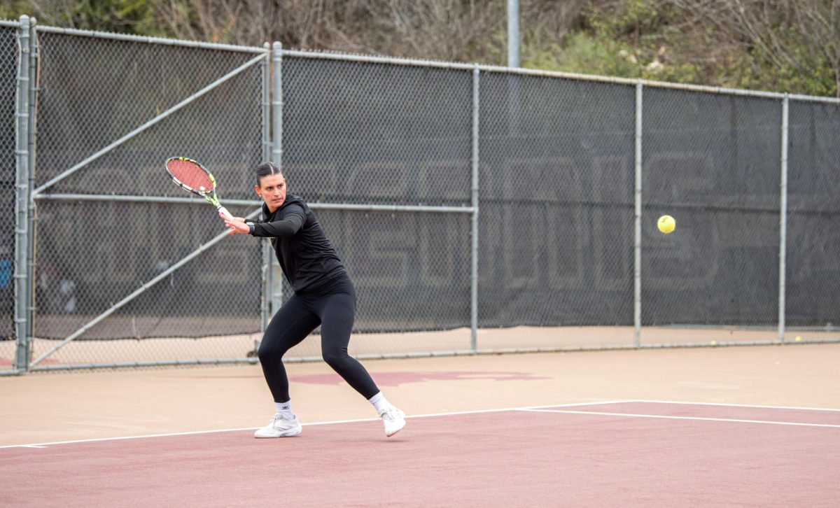 Texas State senior Sofia Fortuno calculates her shot as she clears the net at the match against Tarleton State on Feb. 14, 2025.