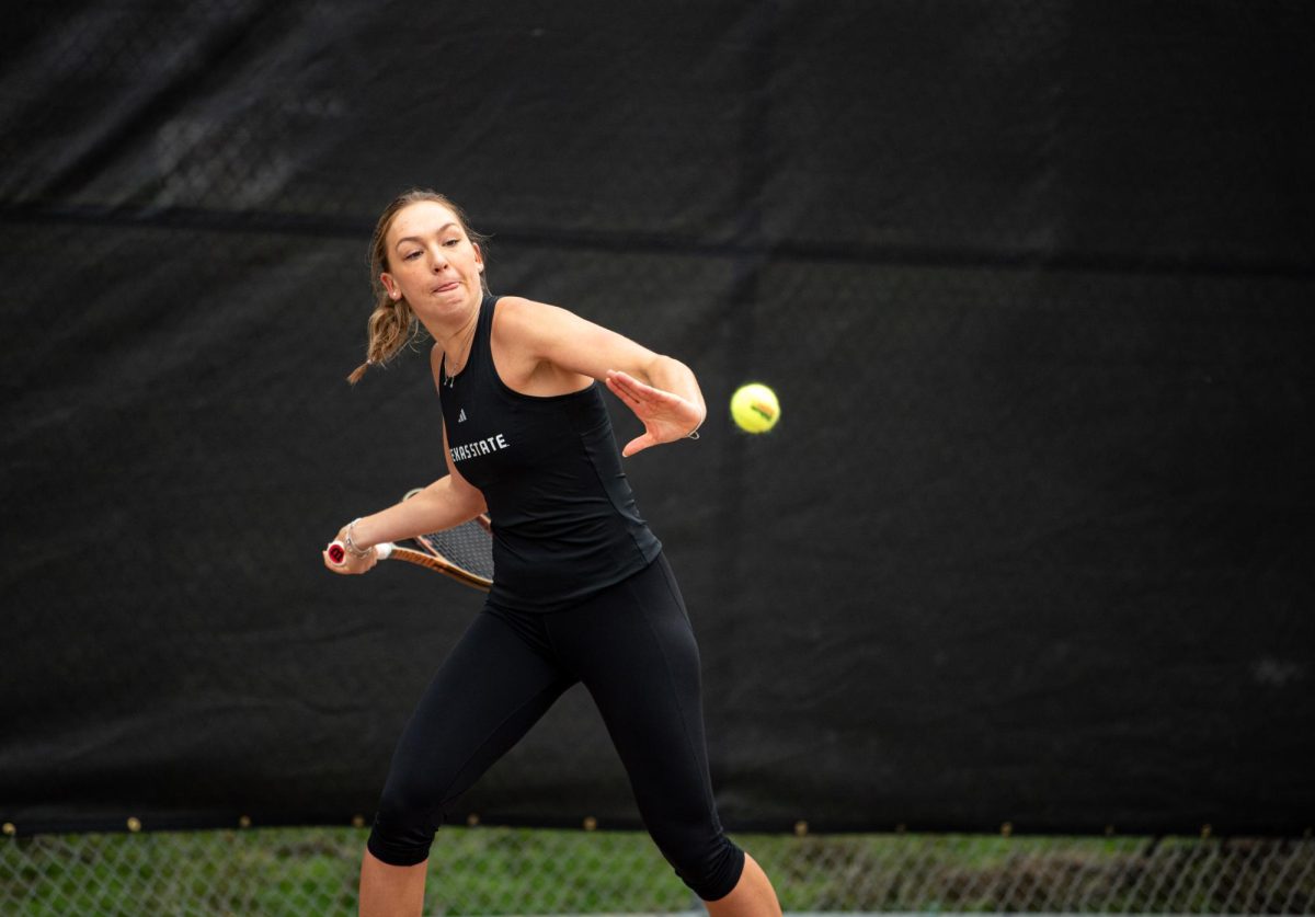 Texas State junior biochemistry major Emily Niers makes a focused hit at the match against Tarleton on Feb. 14, 2025.