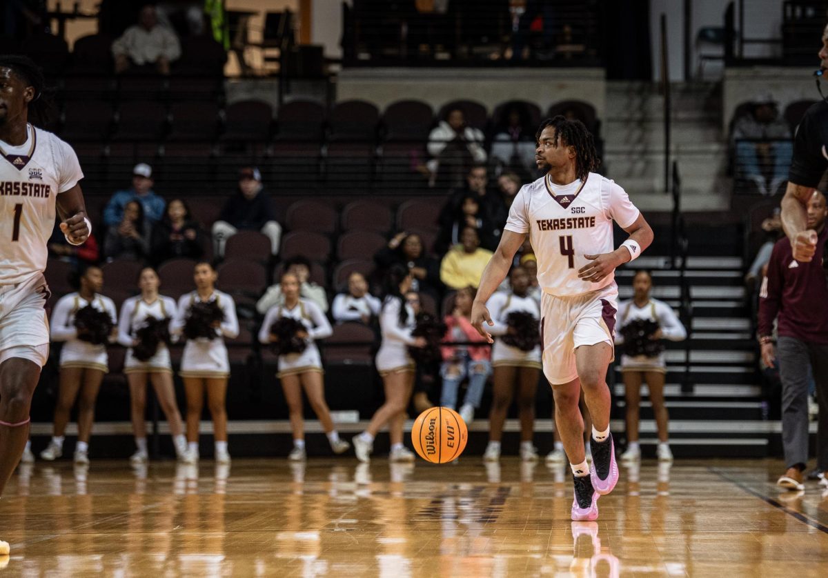 Texas State junior guard Mark Drone (4) dribbles the ball toward the net at the game against University of Louisiana-Monroe, Wednesday,  Feb. 19, 2025, at Strahan Arena.