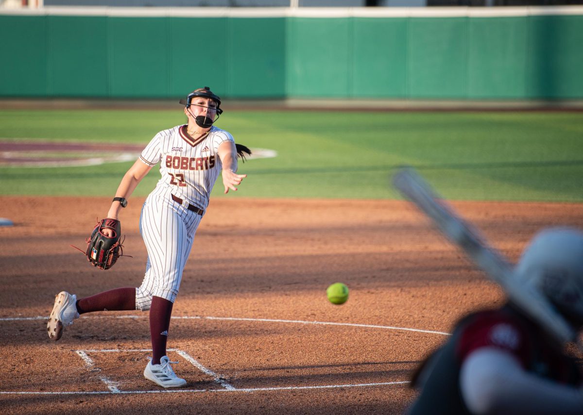 Texas State sophomore pitcher Maddy Azua releases a pitch, Thursday, Feb. 6, 2025, at Bobcat Softball Stadium. Bobcats lost to Arkansas 3-1. 