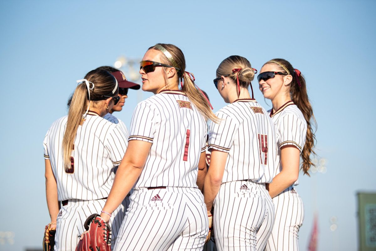 Texas State junior outfielder Emilee Baker (1), gets ready for the upcoming game against the University of Arkansas alongside her teammates, Thursday, Feb. 6, 2025, at Bobcat Softball Stadium. Bobcats to Arkansas lost 3-1.