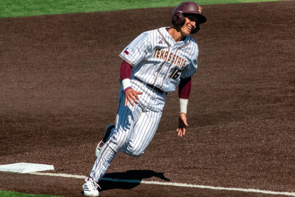 TXST freshman infielder Dawson Park (16) smiles while running from third base to home to score during the baseball game against Binghamton University, Sunday, Feb. 16, 2025, at Bobcat Ballpark. Park scored one of six runs in the bottom of the fourth inning.