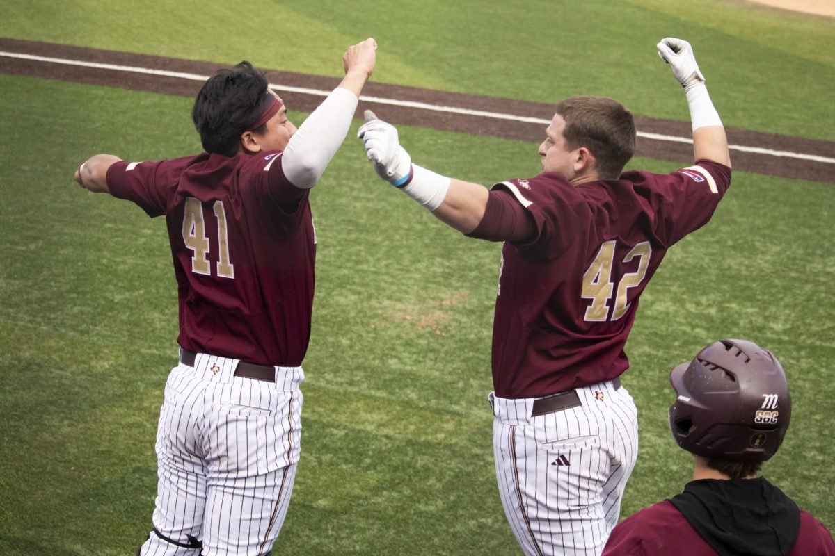 Texas State senior catcher Austin Munguia (42) celebrates hitting a home run against the University of Illinois with Texas State junior catcher Theo Kummer (41), Sunday, Feb. 23, 2025 at Bobcat Ballpark. Bobcats beat Illinois 5-2.