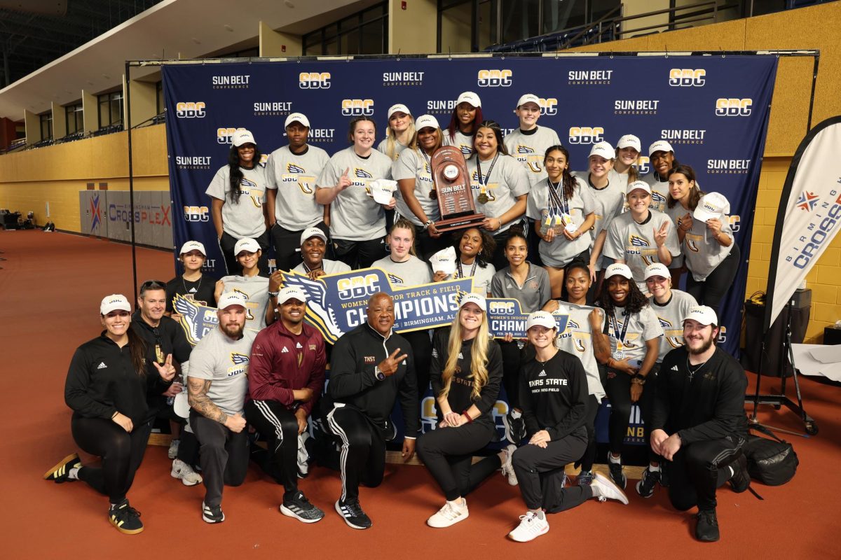 The Texas State women's track and field team poses with the Sun Belt Conference Indoor Championships Trophy on Tuesday, Feb. 25, 2025.