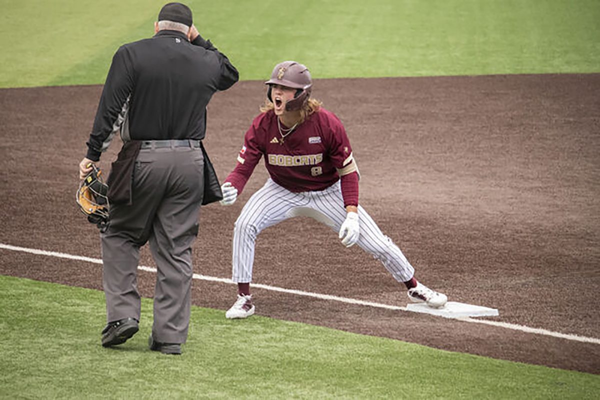 Texas State sophomore outfielder Samson Pugh (8) celebrates reaching third base, Sunday, Feb. 23, 2025 at Bobcat Ballpark. Bobcats beat Illinois 5-2.