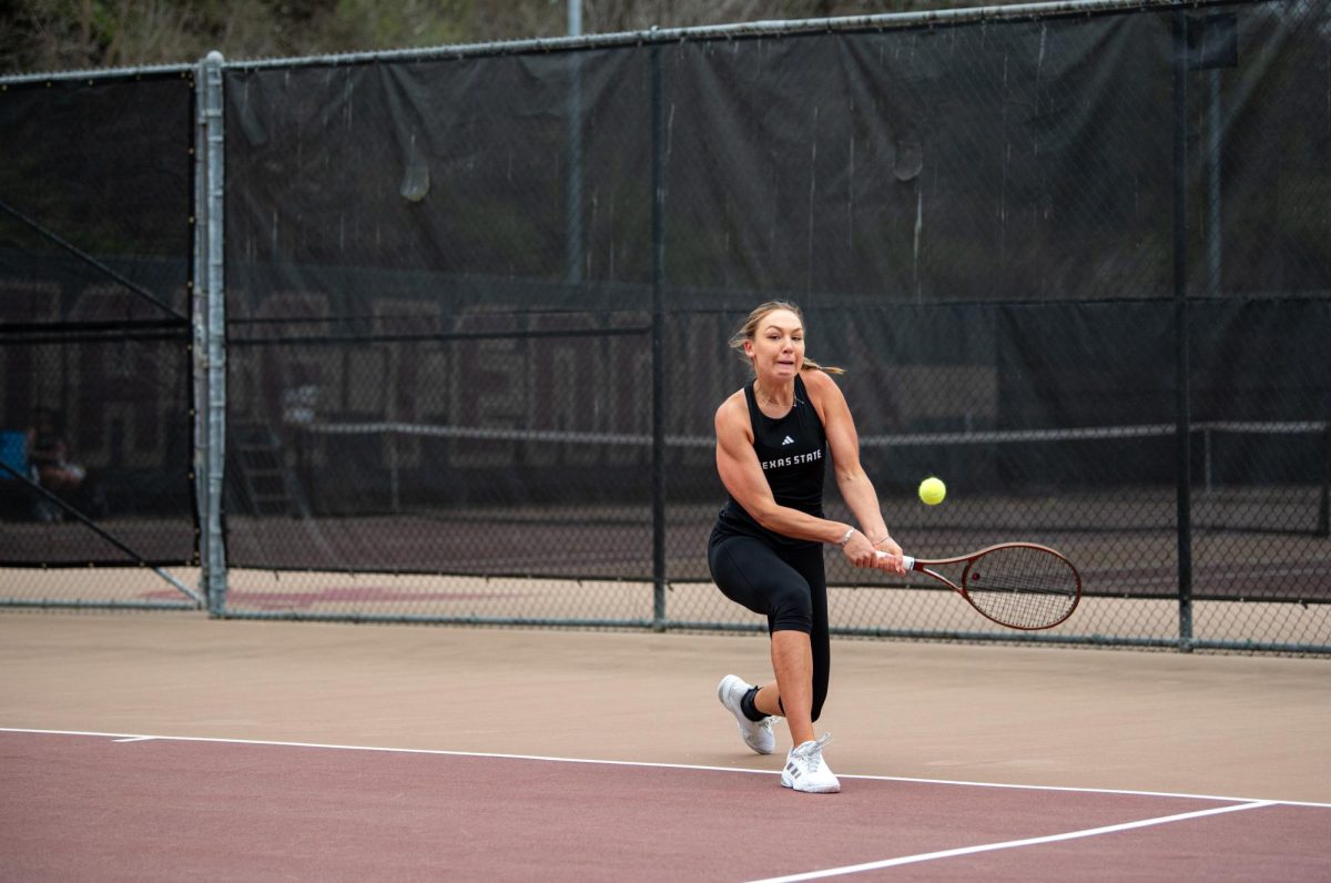 Texas State Emily Niers uses all her strength to make a perfect level hit at Texas State's match against Tarleton State on Feb. 14, 2025.