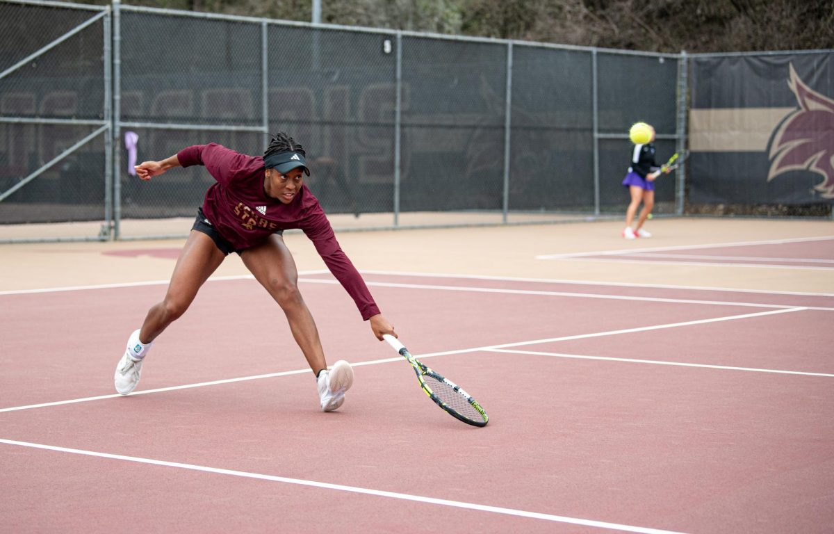 Texas State senior Kiana Graham advances toward the net to return a low-ball from Tarleton State at the match on Feb. 14, 2025.