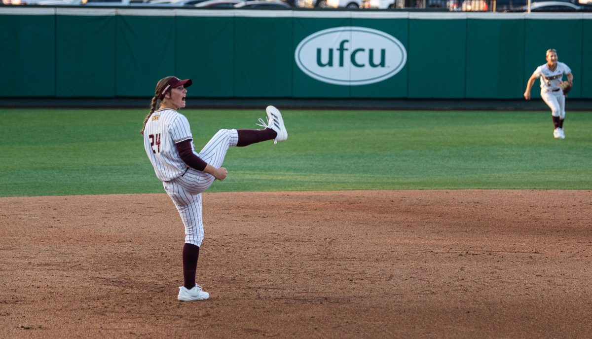 Texas State sophomore #24 Kate Bubela celebrates an out for the Bobcats at the game against the University of Arkansas on Feb. 6, 2025.