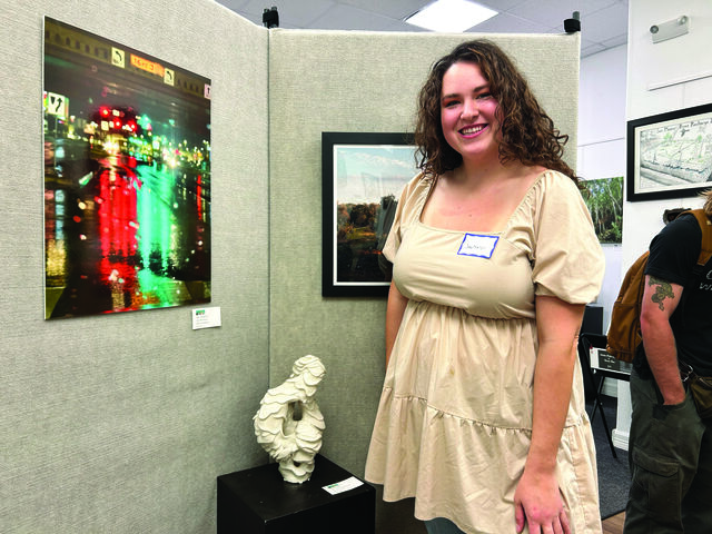 Art alumna Jacqueline Bracamontes poses next to her thesis piece “Untitled“ at the Green Hils Rising showcase, Friday, March 7, 2025, at the San Marcos Art Center.