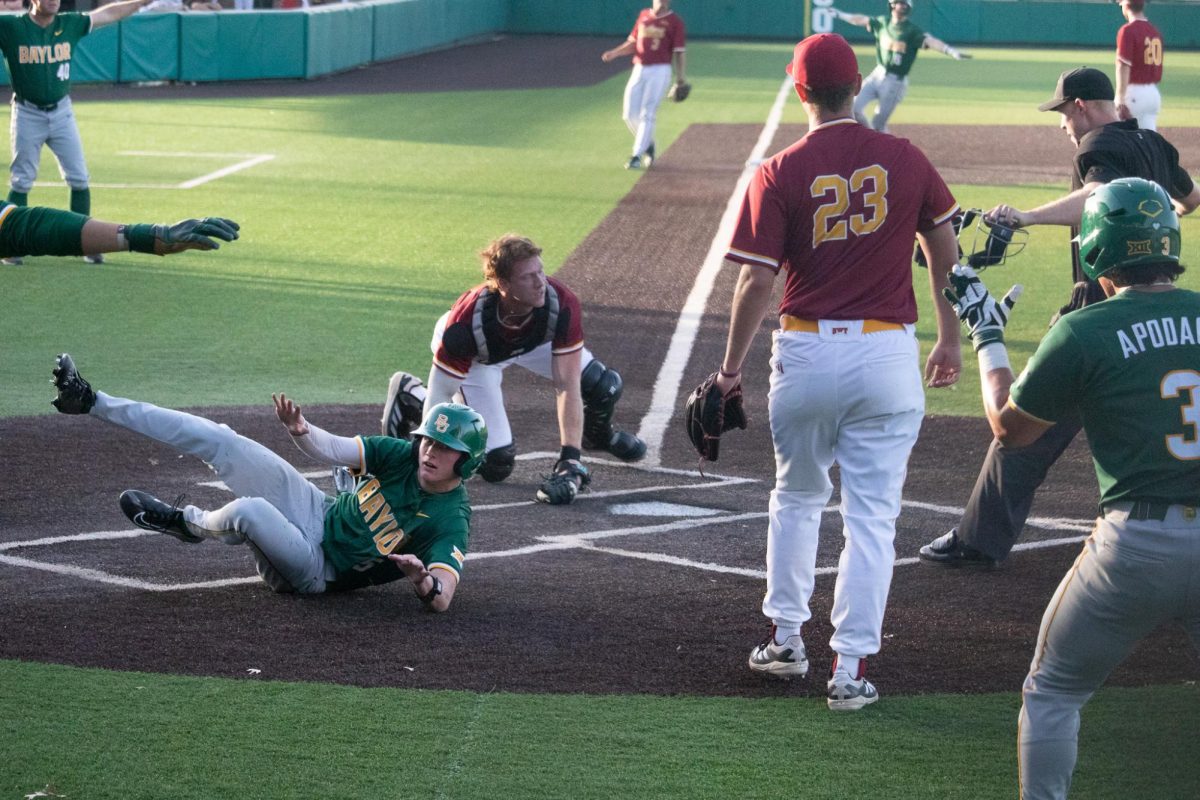 Baylor freshman third baseman Pearson Riebock (5) is called safe after sliding into home base, March 18, 2025, at Bobcat Ballpark. The Bobcats were defeated by Baylor in the seventh inning 19-3.