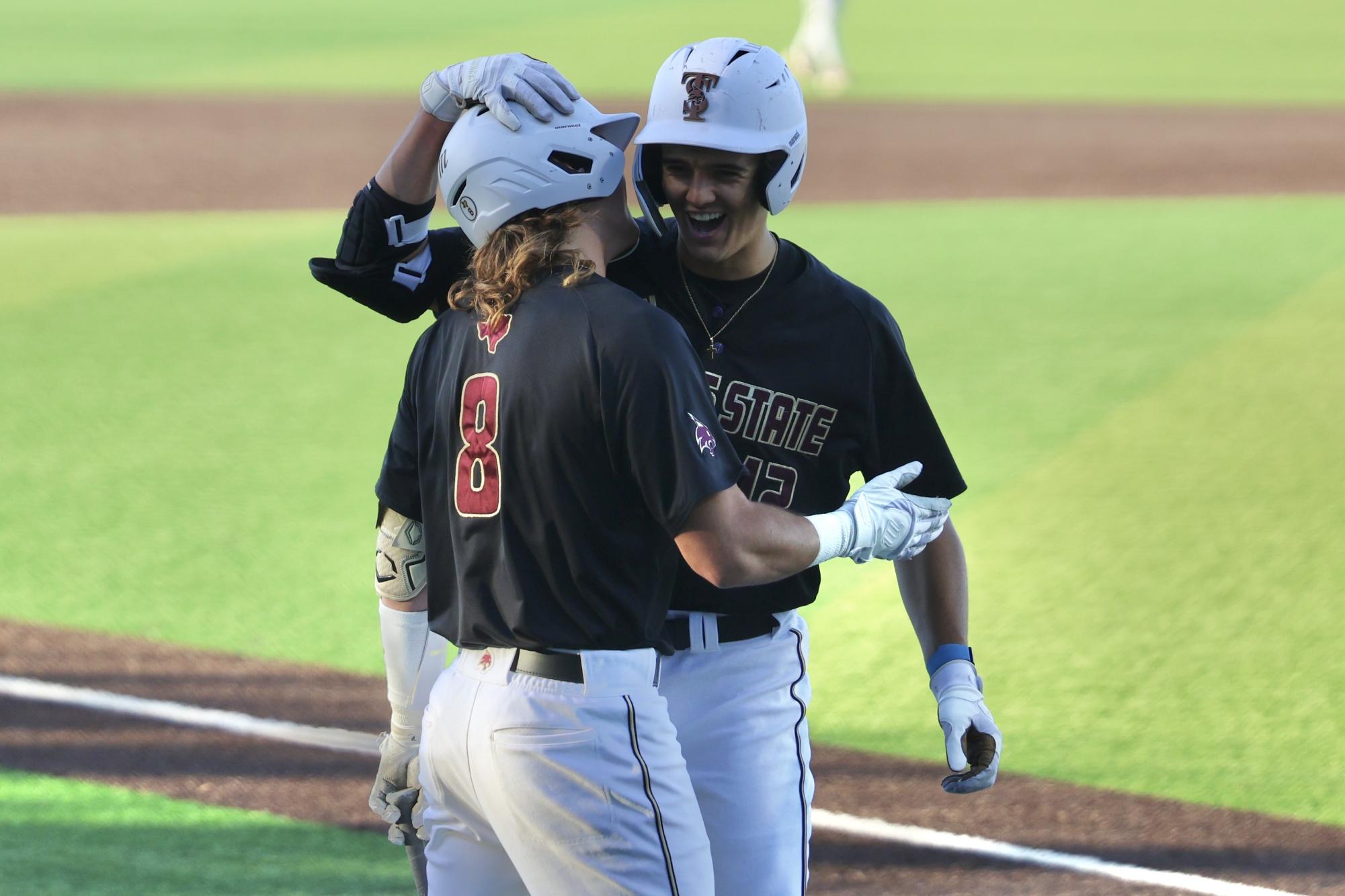 Texas State freshman outfielder Zachary Gingrich (12) celebrates his first collegiate home run against Texas Christian University with Texas State sophomore outfielder Samson Pugh (8), Tuesday, March 11, 2025, at Bobcat Ballpark.