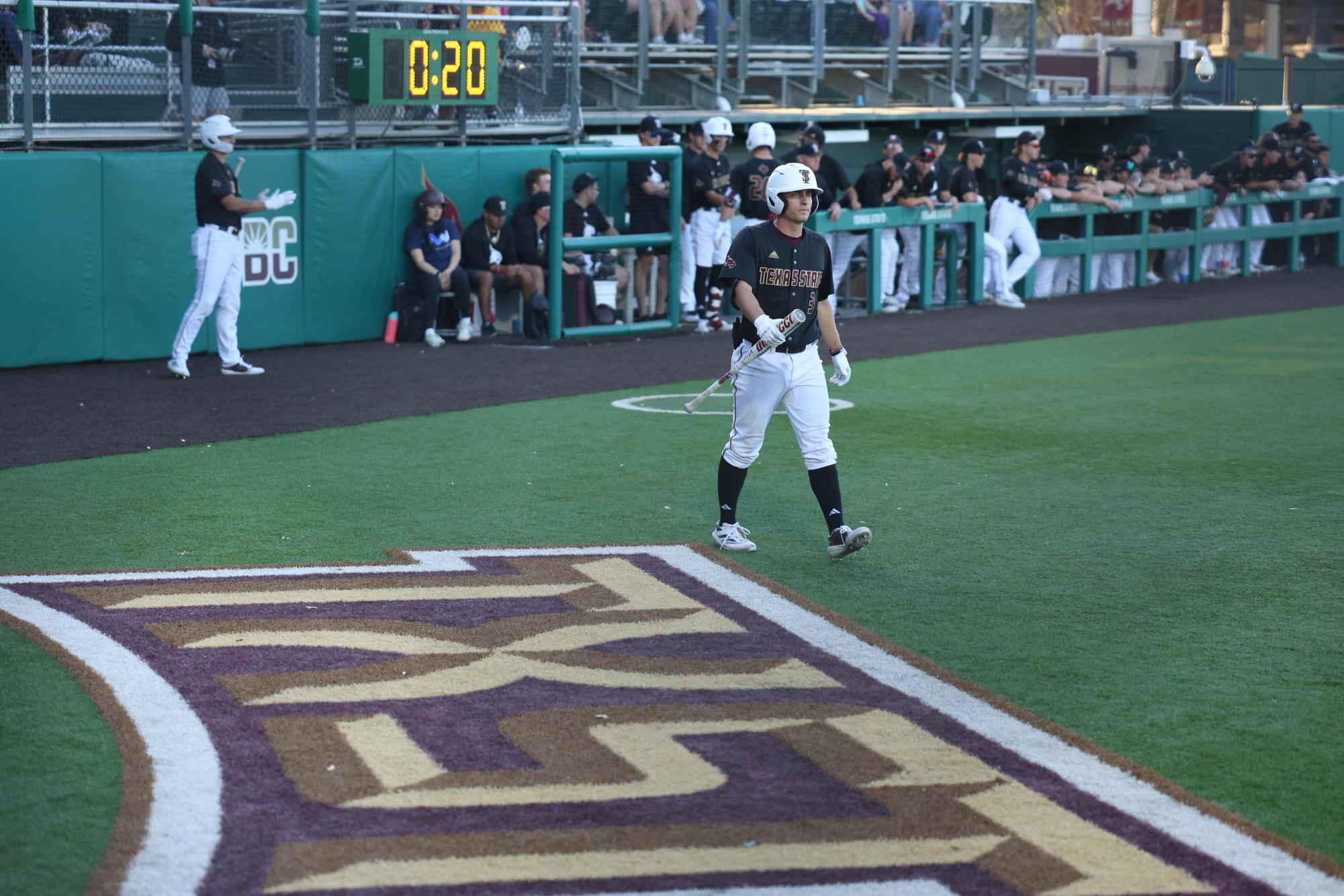 Texas State sophomore shortstop Ryne Farber (3) walking up to an at-bat against Texas Christian University, Tuesday, March 11, 2025, at Bobcat Ballpark.