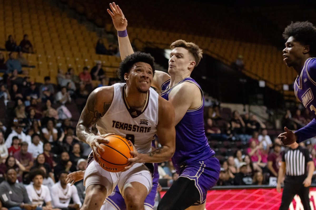 TXST redshirt senior forward Tylan Pope (9) prepares to jump to attempt a shot during the game against James Madison University, Friday, Feb. 28, 2025, at Strahan Arena. Pope scored 23 out of the Bobcats' 102 points.