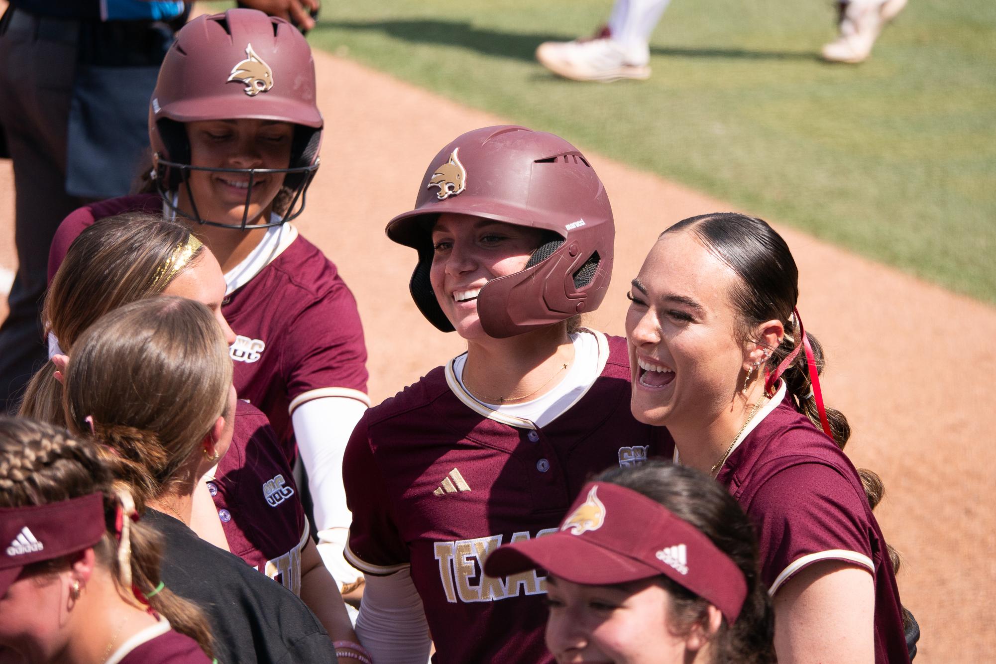 Kate Bubela, sophomore infielder, celebrates with her teammates after hitting a grand slam during the game against Missouri State on Friday, March 8, 2025, at Bobcat Softball Stadium.