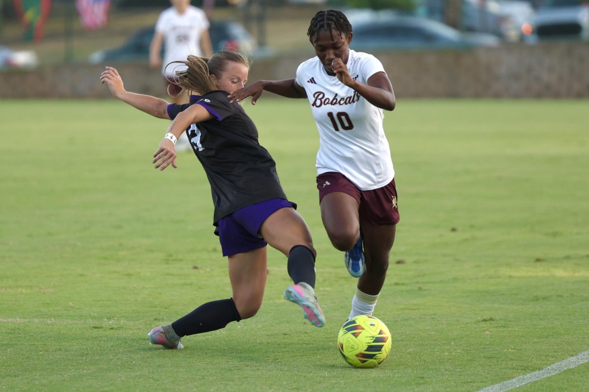 Texas State sophomore midfielder Helen Alormenu (10) attempting to get passed Stephen F. Austin's Alexis Miller (13), 28 Aug., 2025, at Bobcat Soccer Complex.