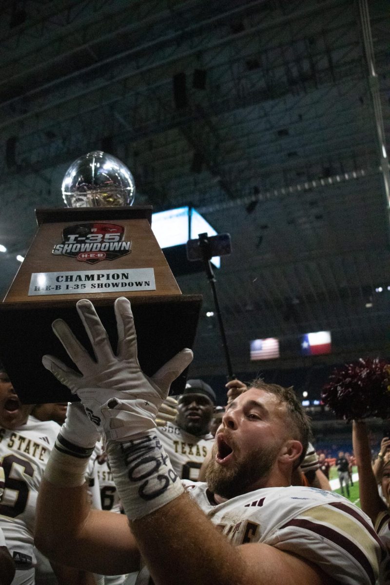 Texas State senior running back Lincoln Pare (7) celebrates winning the I-35 Showdown against UTSA, Saturday, Sept. 6, 2025, at the Alamodome. The Bobcats beat the Roadrunners 43-36.