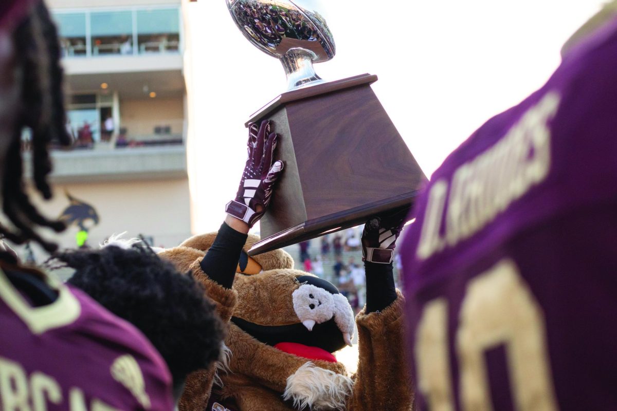 Texas State mascot Boko holds the I-35 Showdown trophy with the Bobcats after defeating  UTSA, 49-10, Saturday, Sept. 7, 2024 at UFCU Stadium. The win marked the first time the Bobcats beat UTSA in their rivalry series. 