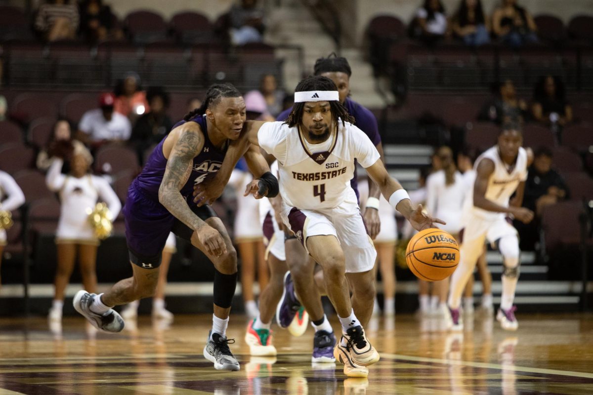 Texas State senior guard Mark Drone (4) dribbles the ball down the court, Tuesday, Nov 19, 2025, at Strahan Arena. The Bobcats won 63-49.