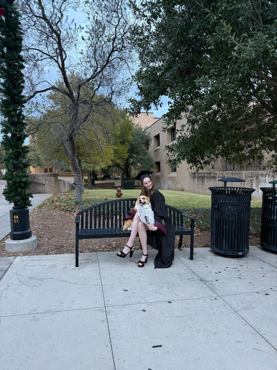 Sports Reporter Candice Gilmore poses with her dog for her graduation photos, Thursday, Nov. 20, 2025, on The Quad. 