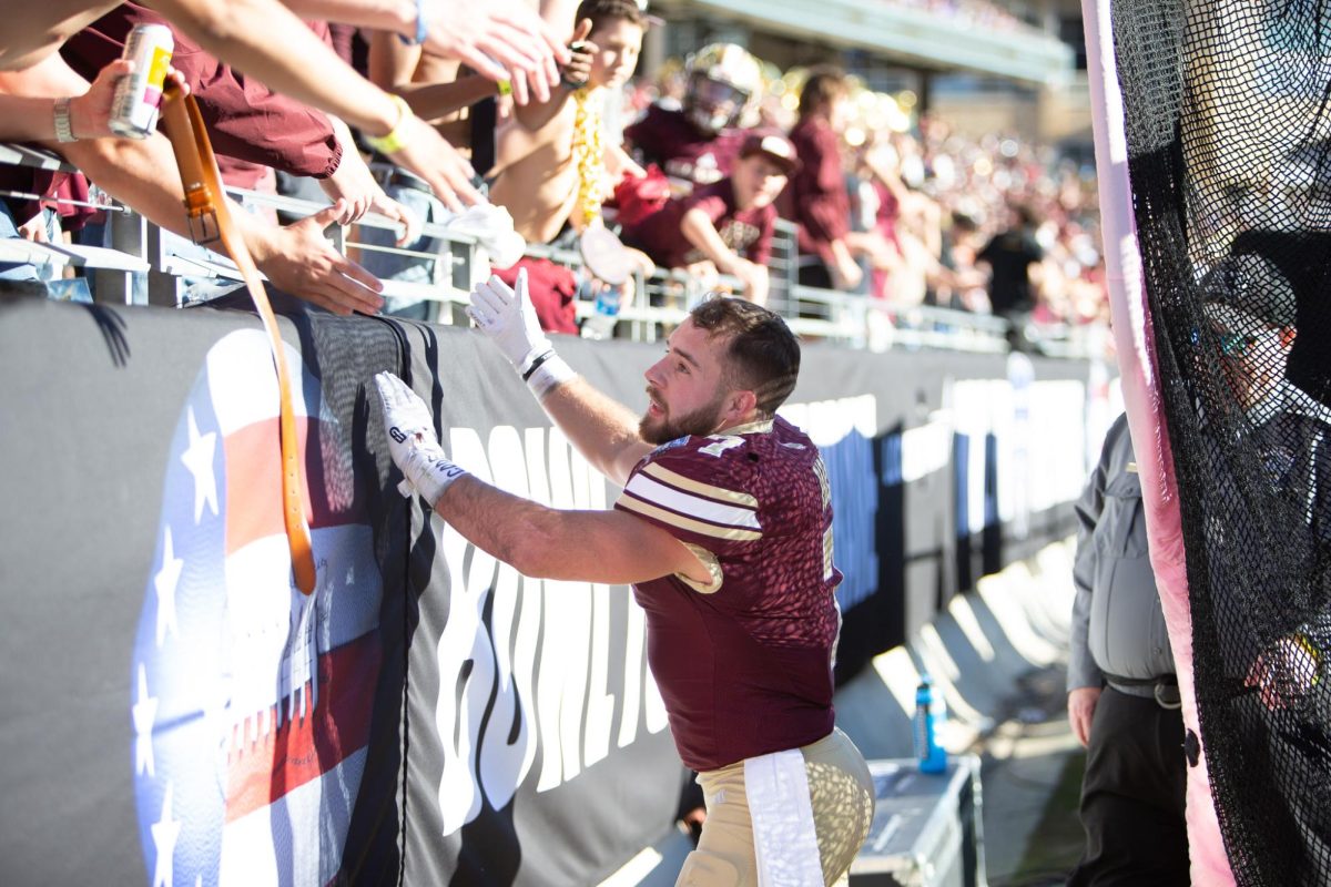 Texas State senior running back Lincoln Pare (7) interacts with Texas State fans, Friday, Jan. 2, 2026, at the Amon G. Carter Stadium. Bobcats won 41-10.