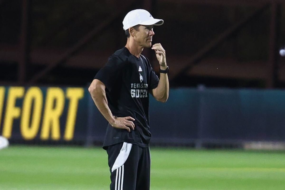 Texas State soccer head coach Steve Holeman watches his team warmup before the first round of NCAA tournament. Texas State lost 3-0 to Baylor.