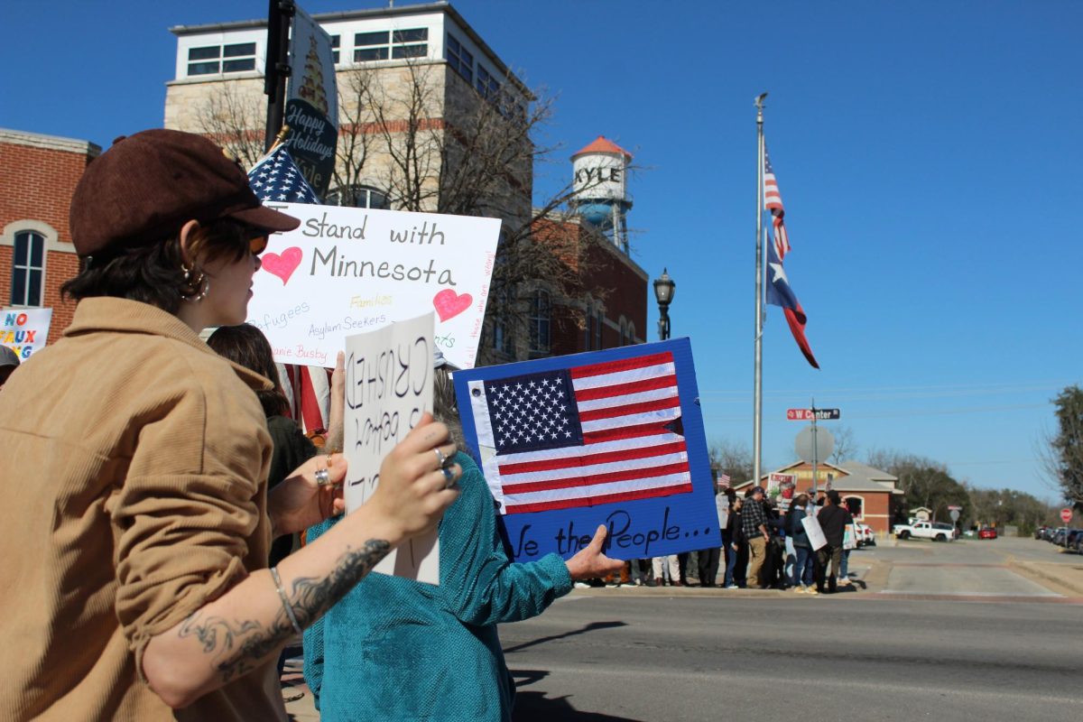Protestors participate in the ICE Out of Hays County protest hosted by Mano Amiga, Sunday, Jan. 18, 2026, at Kyle City Hall. The event served to raise awareness and demand the sheriff to say no to signing a 287(g) agreement.