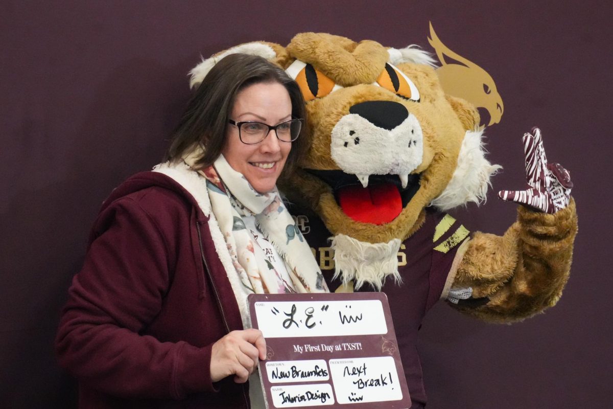 Texas State interior design junior Lou Ellen Davis celebrates her first day of school with Boko as part of the Bobcats Back photo opportunity at LBJSC, Tuesday, Jan. 20, 2026.