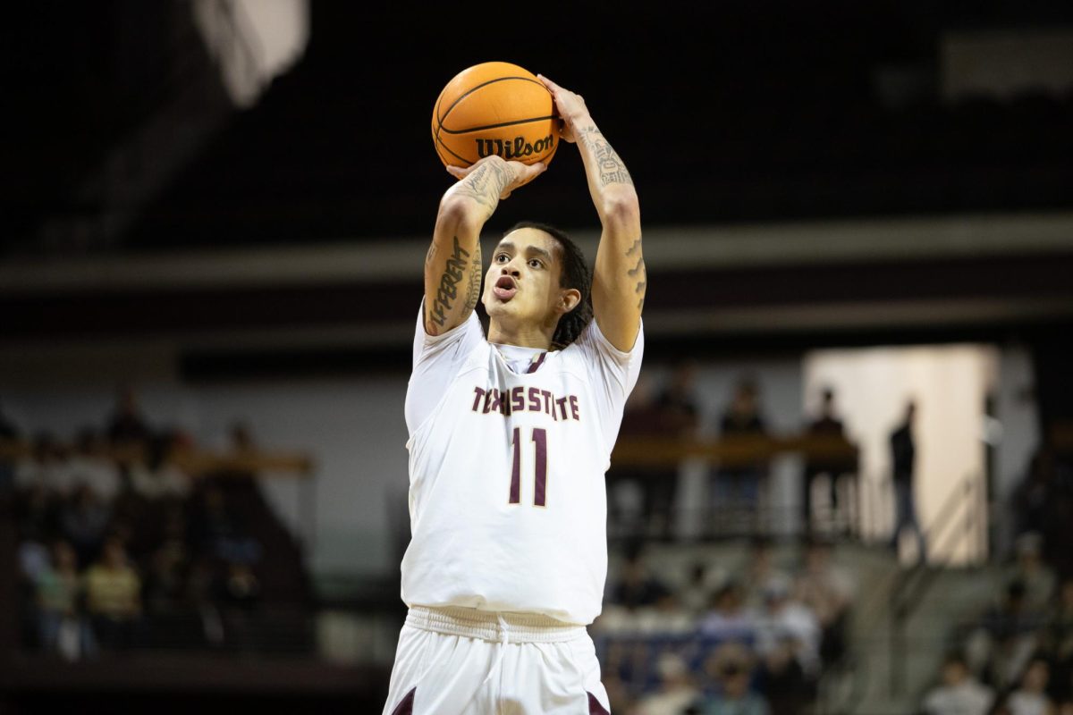 Texas State junior guard Kaden Gumbs (11) shoots the ball. Wednesday, Feb 12, 2026, at Strahan Arena. Texas State beat Troy 74-62.