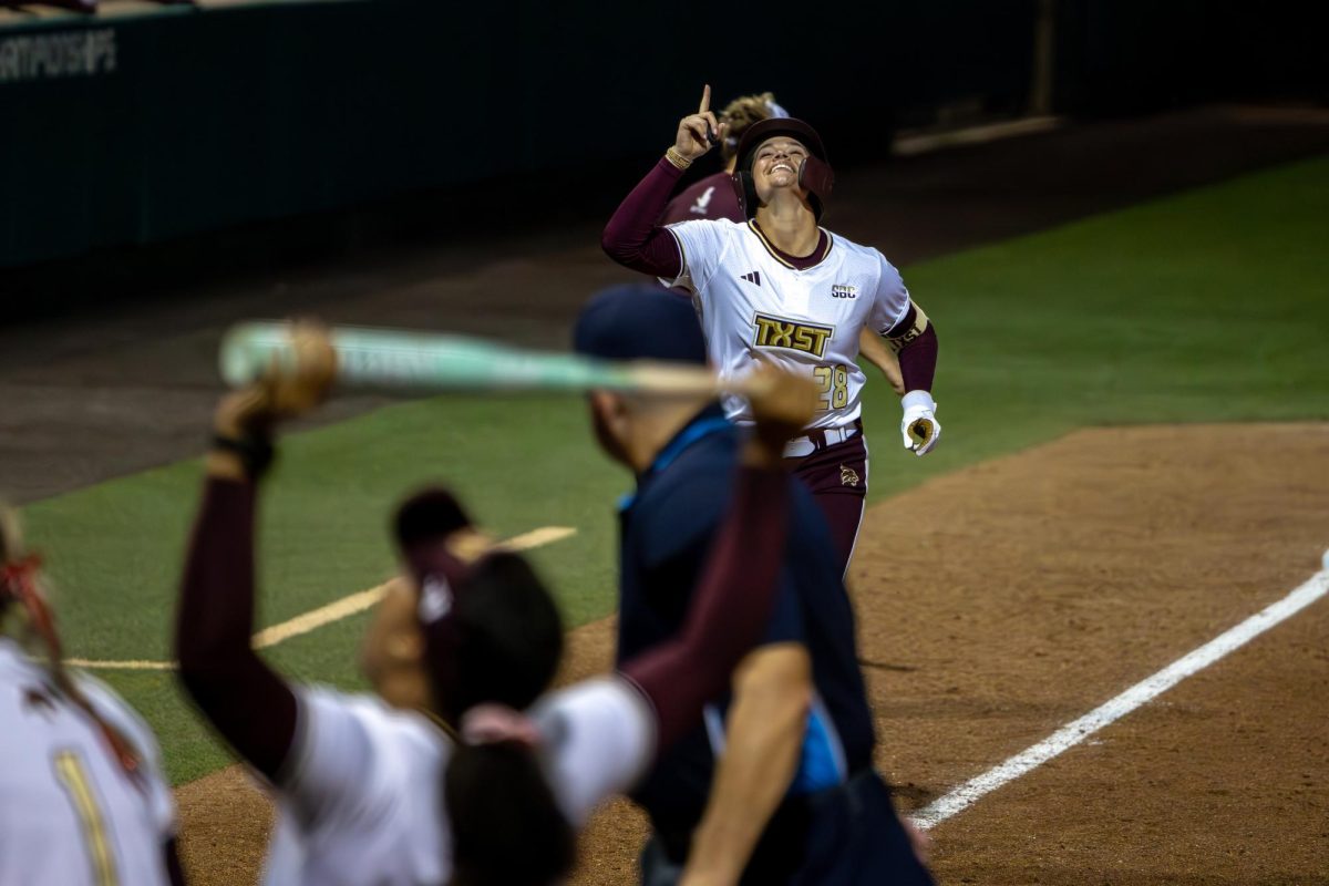 Texas State junior second basemen Katarina Zarate (28) rounds third and points to the sky to celebrate a solo home run against No. 18 Clemson, Thursday, Feb. 12, 2026, at Bobcat Softball Stadium. The Bobcats shutout the Tigers 4-0.