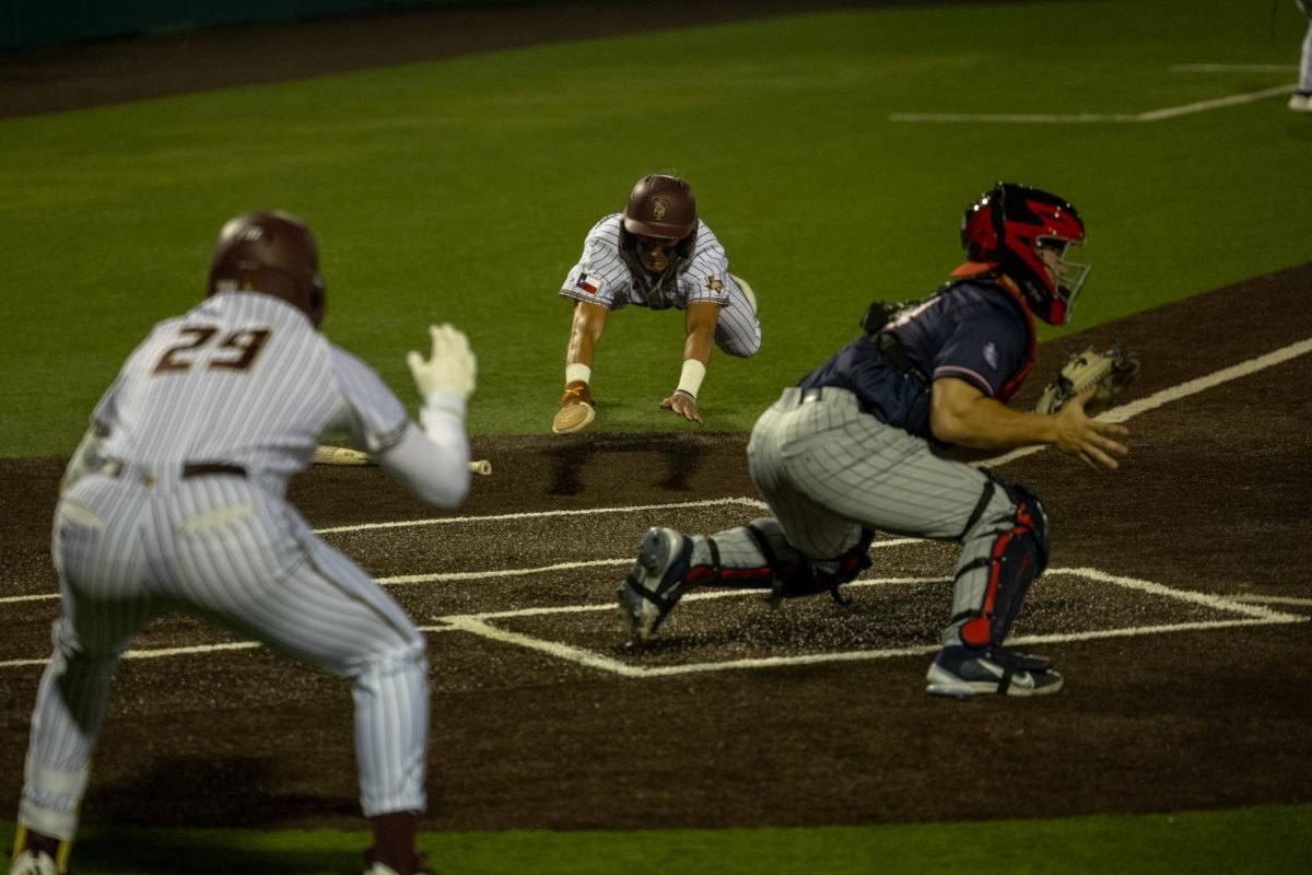 Texas State senior third baseman Chase Mora (2) dives toward home to score a run against Gonzaga, Friday, Feb. 20, 2026, at Bobcat Ballpark. The Bobcats won 8-6. 