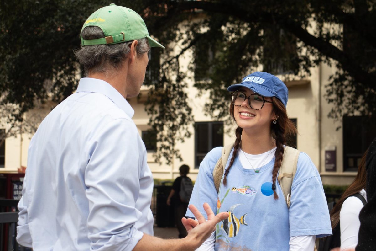 Bailey McBride, theater education freshman, chats with Beto O'Rourke after she registered to vote on The Quad on Monday, Feb. 2, 2026.
