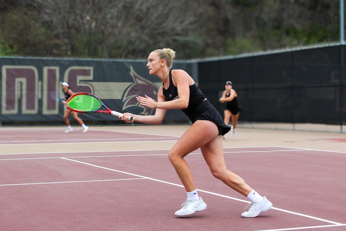 Texas State freshman Olivia Collins gets ready to return serve during her doubles match with Ireland Simme against Incarnate Word, Sunday, March 8, 2026, at the Bobcat Tennis Complex.