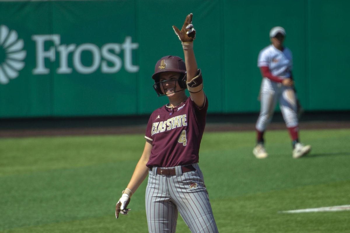 Texas State sophomore utility Mayson Garrett (4) raises States Up after a double against Louisiana-Monroe, Saturday, March 14, 2026, at Bobcat Softball Stadium. The Warhawks won 6-3.