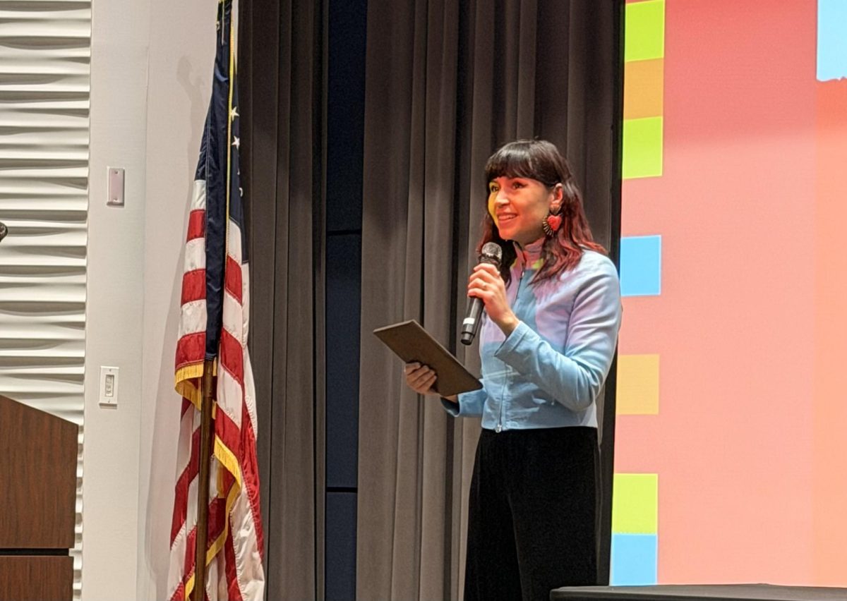 Creative writing alumna and executive director and founder of "Infrarrealista Review" Juania Sueños gives a speech after receiving the 2026 NACCS Tejas Foco Poetry award, Saturday, Feb. 28, 2026, in the Wilhelmina Cullen Auditorium at the University of Houston-Downtown.