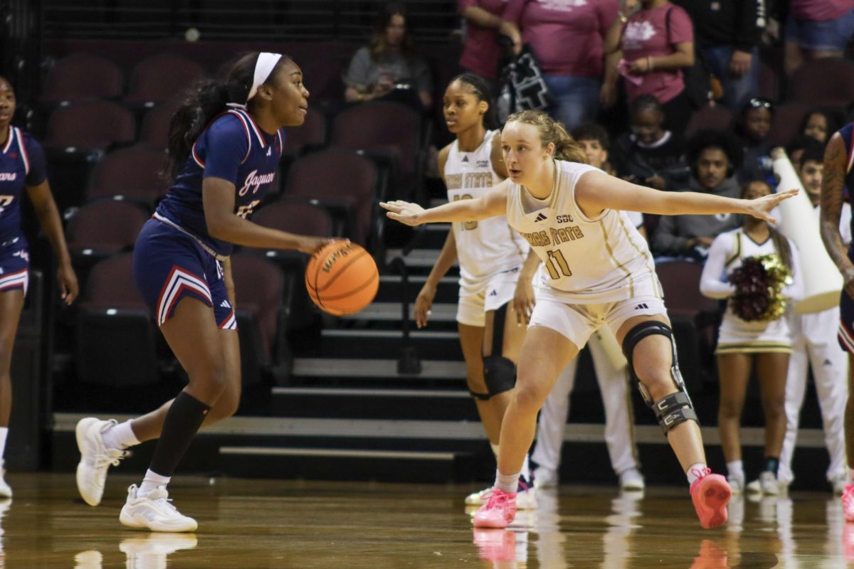 Texas State redshirt sophomore guard Mia Galbraith (11) defends against a South Alabama player, Saturday, Feb. 21, 2026, at Strahan Arena. The Bobcats lost 64-59.