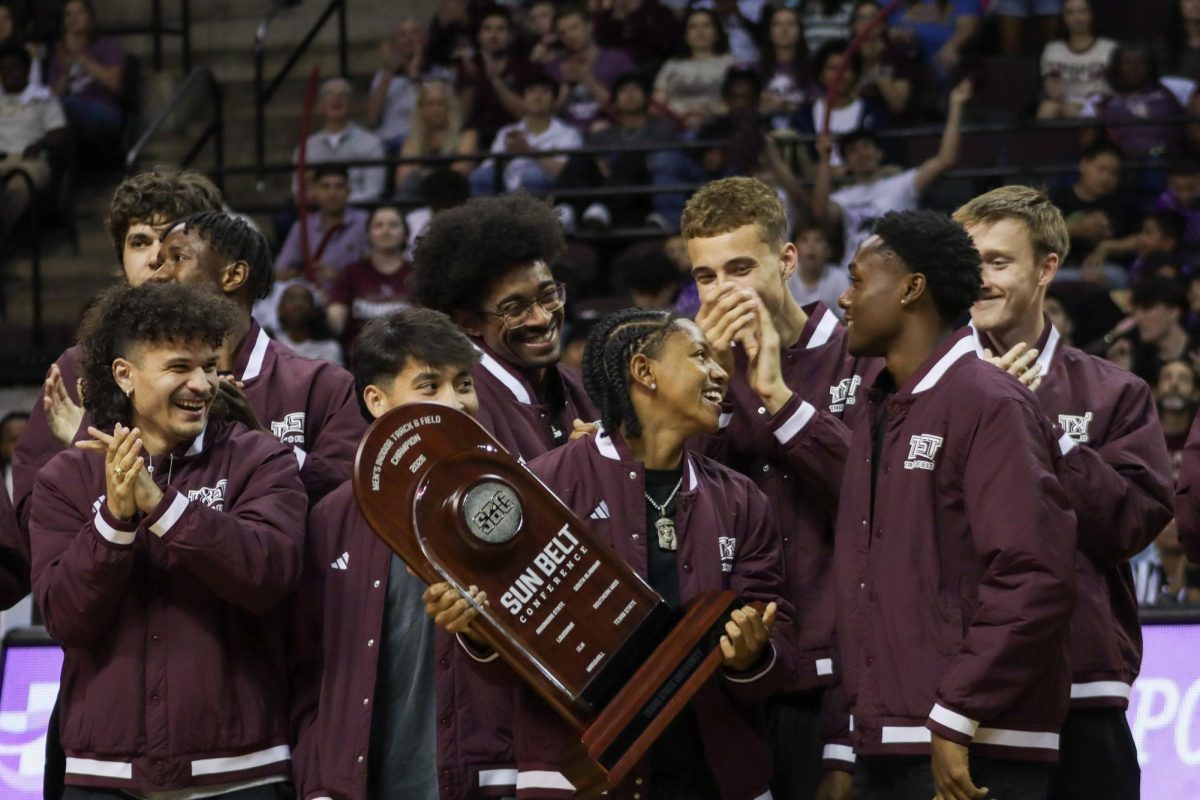 The Texas State Men's Track and Field team celebrate winning the Sun Belt Indoor Track & Field Championship, Friday, Feb. 27, 2026, at Strahan Arena. The team was recognized during halftime at the men's basketball game, along with the women's team; the win marked the first time in program history that both the ben's and women's teams won the Sun Belt Indoor Track & Field Championship concurrently.