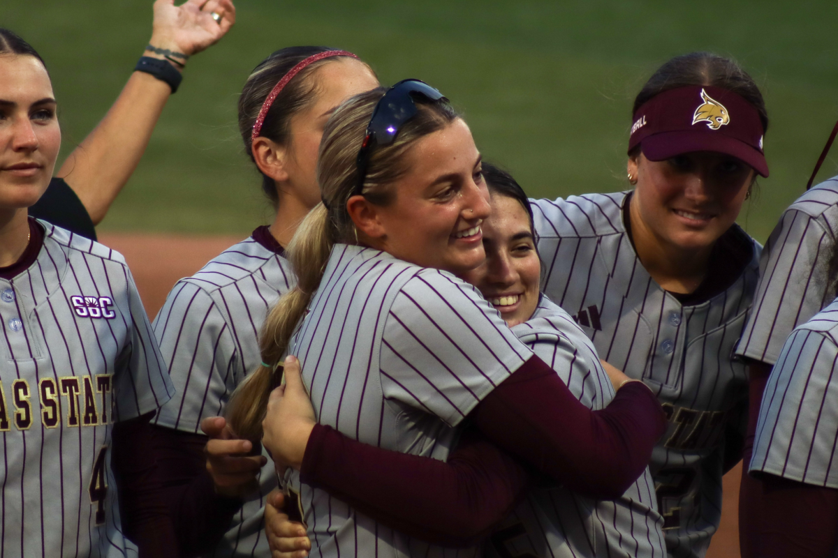 Texas State redshirt freshman outfielder Harley Vestal (12) hugs freshman catcher/ infielder Sophie Sandel (5) after the win against Texas A&M, Friday, March 6, 2026, at Bobcat Softball Stadium. The Bobcats won 3-1 