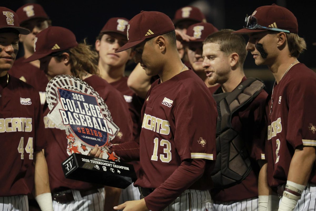 Texas State junior pitcher Jesus Tovar (13) holds tournament trophy after win against Abilene Christian, Sunday, March 1, 2026, at La Moderna Field, Cleburne, Texas. The Bobcats won 3-0.