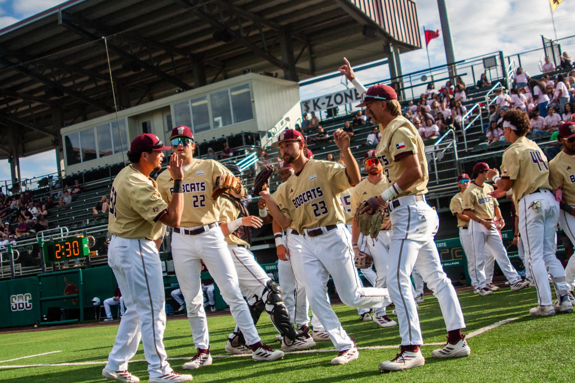 Texas State senior starting pitcher Ryan Markwardt (23) runs out of the dugout, Wednesday, April 8, 2026 at Irvine-Rasmussen Ballpark. The Bobcats beat the Stephen F. Austin Lumberjacks 10-0.