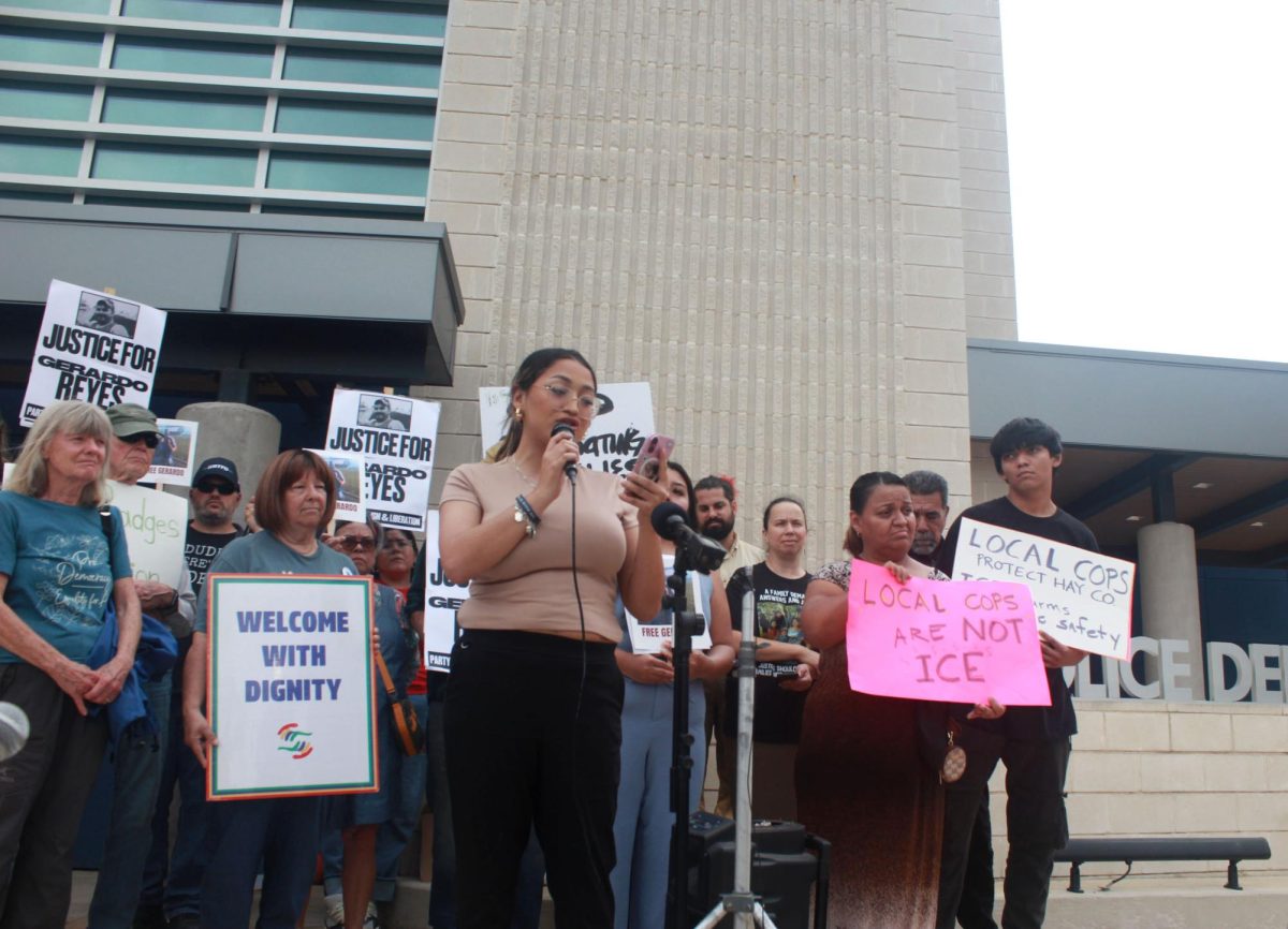 Guadalupe "Lupe" Sarinana, the daughter of Gerardo Reyes, stands with her family and crowd, Friday, April 10, 2026, at the front of the San Marcos Police Department. 