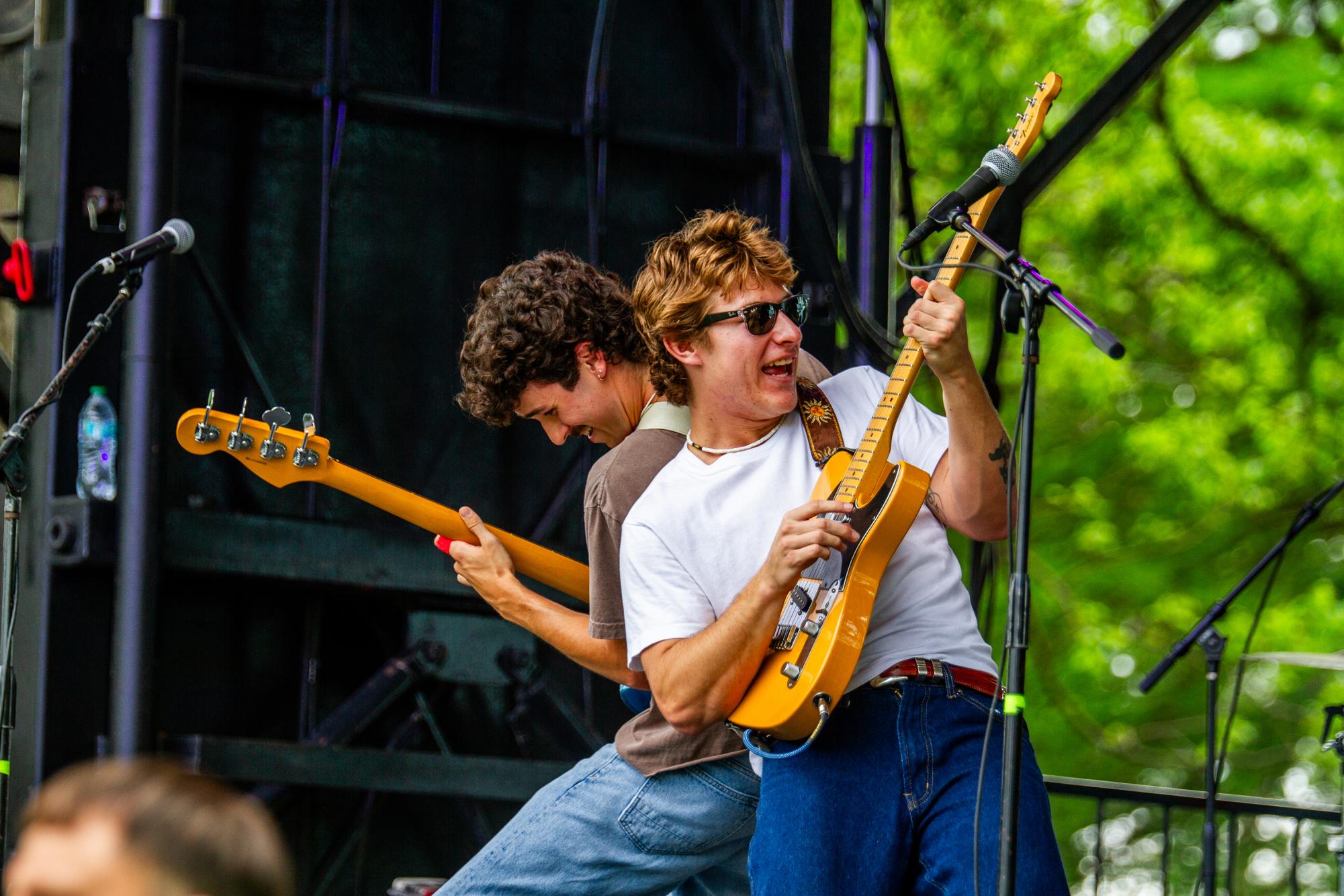 4411 bassist Nick Speer (left) and lead singer of the 4411 Cogan McBride (right) perform at River Fest, Thursday, April 16, 2026, at Sewell Park. The 4411 is an indie folk band consisting of Texas State students. 