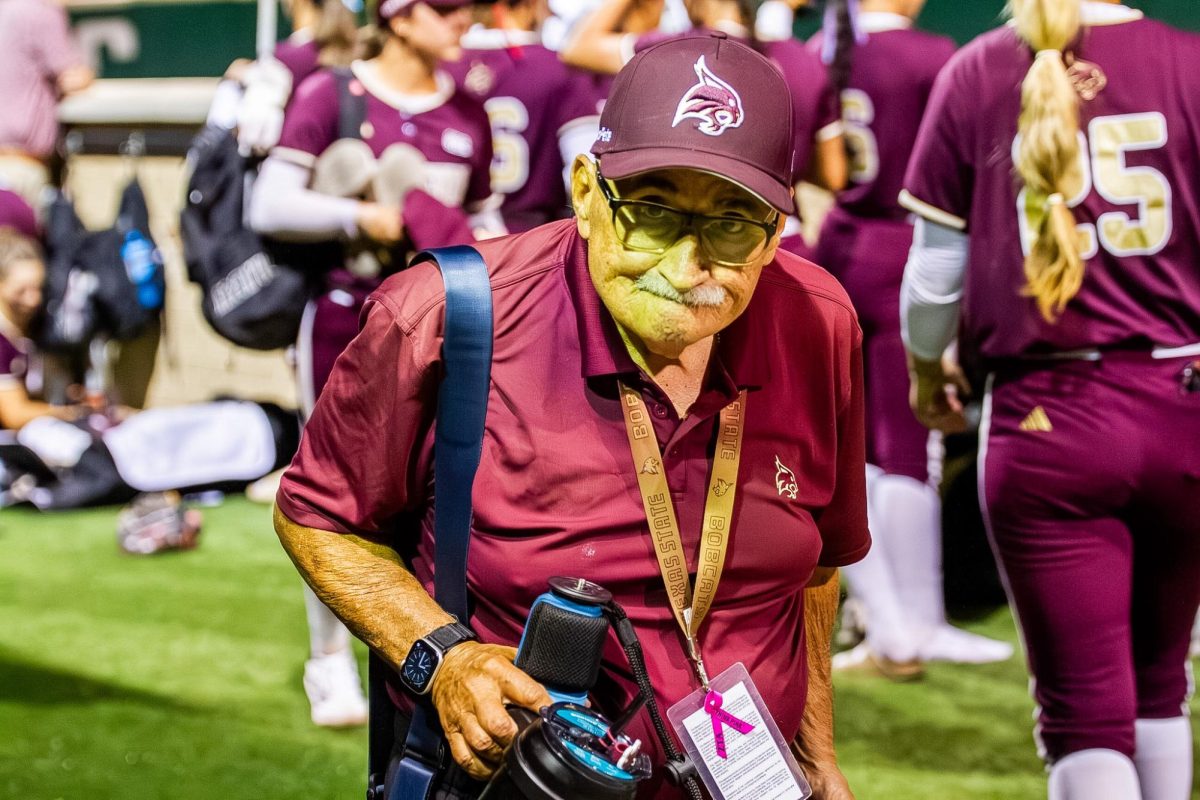 Texas State photographer Peter Vives, better known as Photo Pete, leaves a softball game, Wednesday, March 25, 2026, at Bobcat softball stadium. 