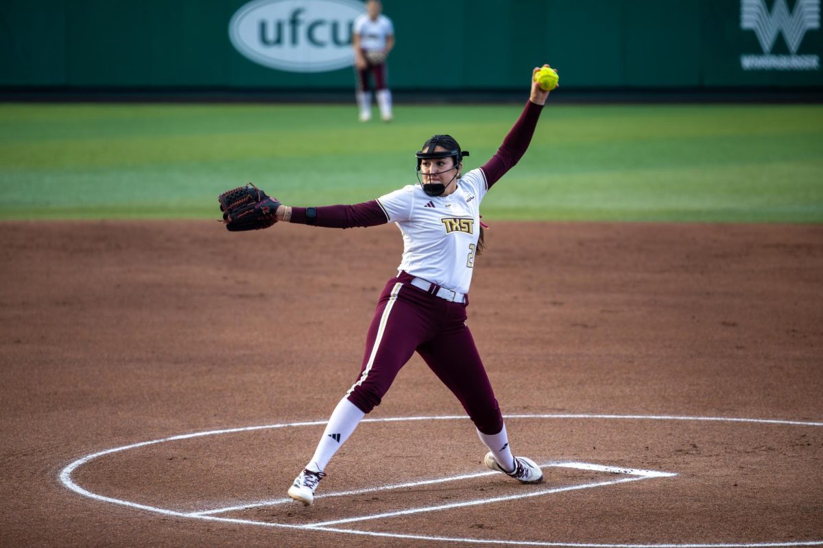 Texas State junior pitcher Madison Azua (22) pitches against No. 18 Clemson, Thursday, Feb. 12, 2026, at Bobcat Softball Stadium. The Bobcats shutout the Tigers 4-0.